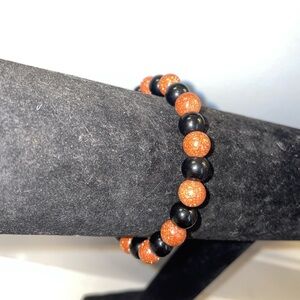 Handmade sparkly sandstone and black glass beaded bracelet